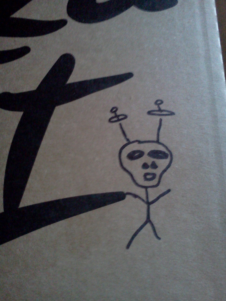 An alien drawn on a Pizza Hut box.
