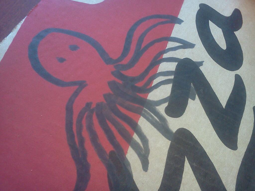 A Pizza Hut box with an octopus drawn on it.